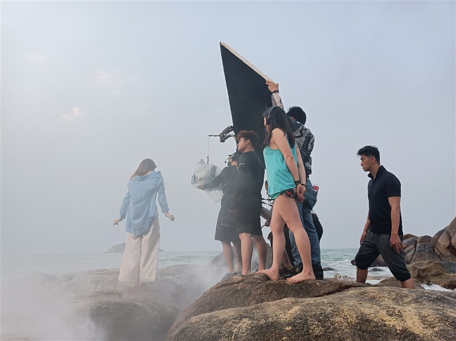 Qingdao production team preparing camera and lighting gear